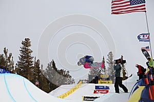 Snowboarder getting filmed at the half-pipe competition, Mammoth Mountain, California USA