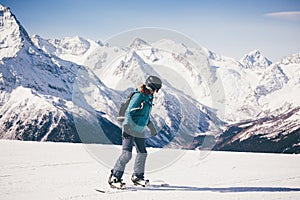 Snowboarder girl in the mountains.