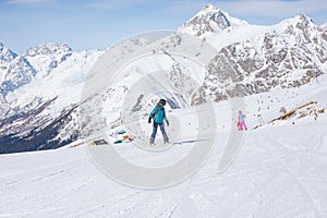 Snowboarder girl in the mountains.