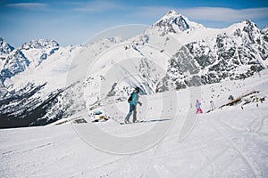 Snowboarder girl in the mountains.