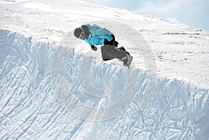Snowboarder in Half pipe