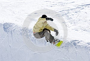 Snowboarder on half pipe of Pradollano ski resort in Spain