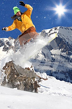 Snowboarder in high mountain