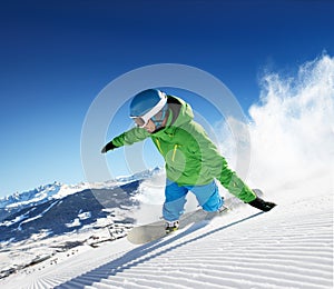 Snowboarder in high mountains