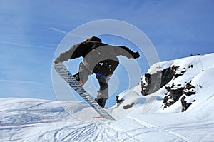 Snowboarder jumping