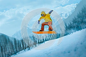 Snowboarder jumping through air with deep blue sky in background