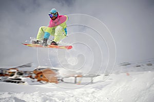 Snowboarder jumping high