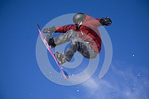 Snowboarder jumping high img