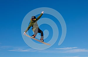 Snowboarder jumping high in the air