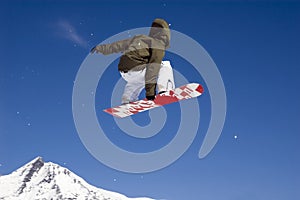 Snowboarder jumping high in the air