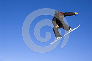 Snowboarder jumping high in the air