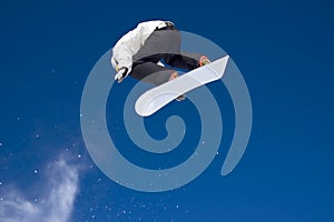 Snowboarder jumping high in the air