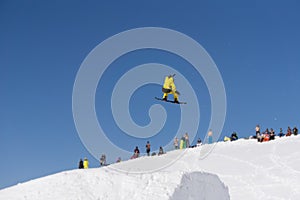 Snowboarder jumps in Snow Park