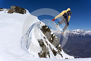 Snowboarder jumps in Snow Park