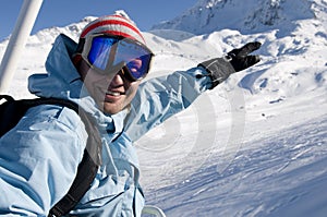 Snowboarder on lift at ski resort