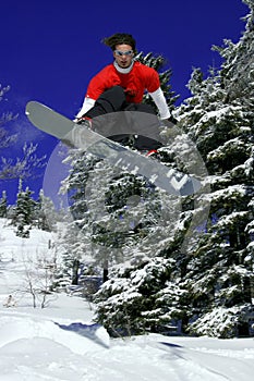 Snowboarder make a jump