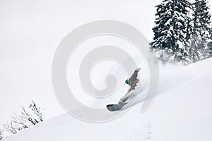 a snowboarder making a sharp turn down the hill