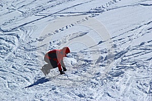 Snowboarder in motion, the snowboarder on the ski slope