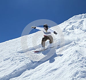 Snowboarder moving down