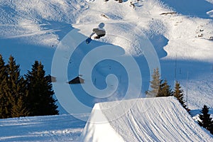 Snowboarder performing a freestyle jump