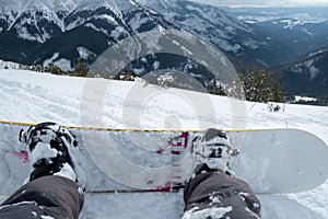 Snowboarder point of view from the slope