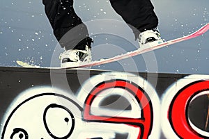 Snowboarder on rail