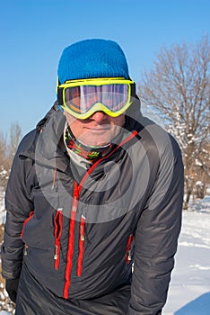 Snowboarder resting on the ski resort