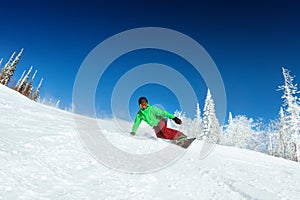 Snowboarder rides on slope snowboarding