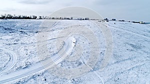 Snowboarder riding down the slope, aerial view