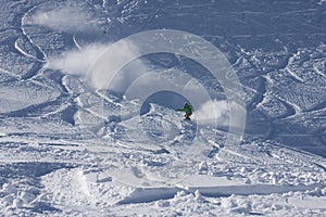 Snowboarder riding in powder