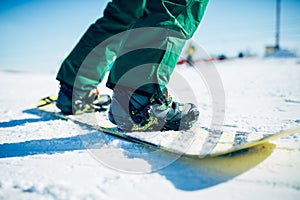 Snowboarder riding a snow hill, extreme sport