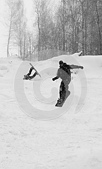 Snowboarder's jump and misfortune photo