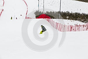 snowboarder, skier skiing from downhill