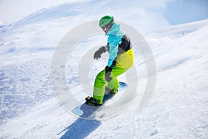 Snowboarder sliding down a slope