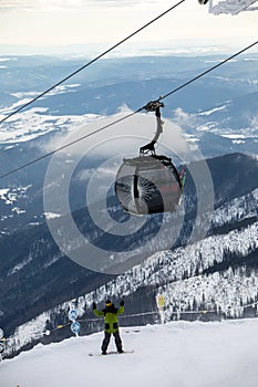Snowboarder at the slope of chopok mountain in slovakia