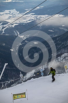 Snowboarder at the slope of chopok mountain in slovakia