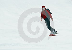 Snowboarder on snow slope