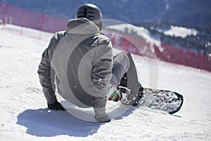 Snowboarder on a snowy slope.