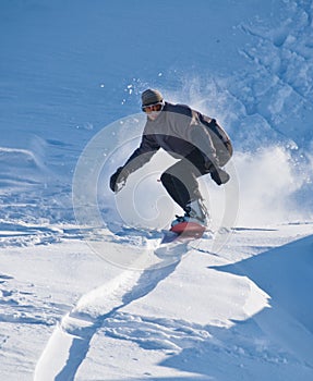 Snowboarder Speeding Downhill