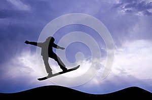 Snowboarder at sunset