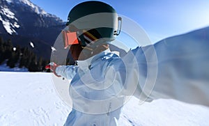 snowboarder taking selfie on winter mountain top