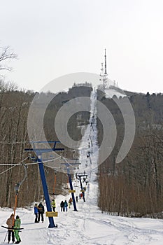 Snowboarder using a surface lift on the slope