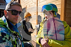 Snowboarders Preparing for a Day on the Slopes
