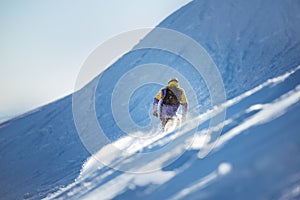 Snowboarding concept with offpiste backcountry snowboarder or skier photo