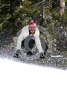 Snowboarding in a forest