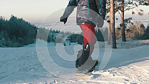 Snowboarding - a man with prosthetic leg standing on the board - showing a basic trick with jumping and turning around -