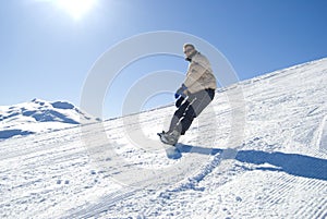 Snowboarding in the sun stock photo