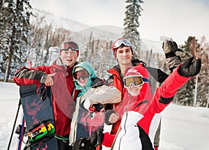 snowboarding team in winter mountains photo