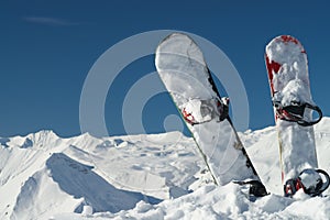 Snowboards in snowy mountains