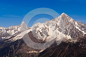 Snowbound mountain peaks. French Alps